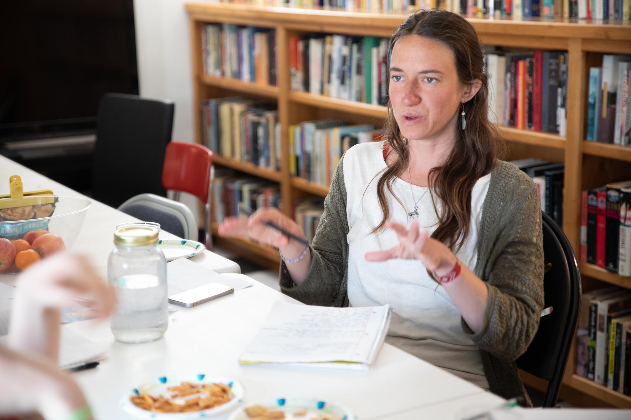 Seated woman talking at SOMOS writers group