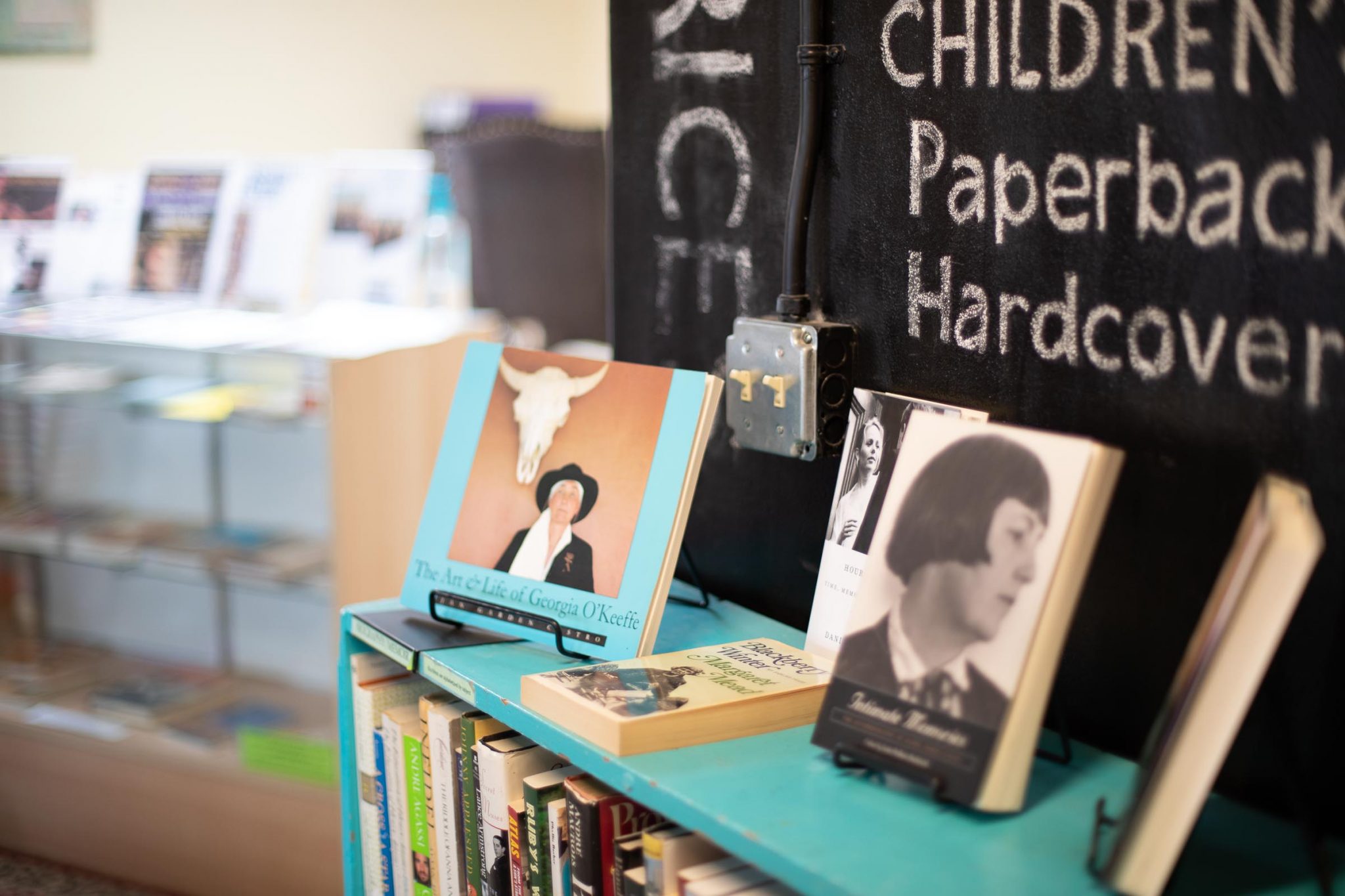 A book display for prose month at SOMOS