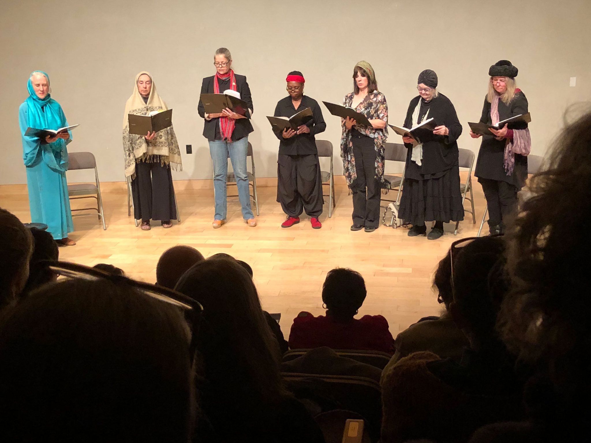 A group of women reading as part of the SOMOS writers showcase